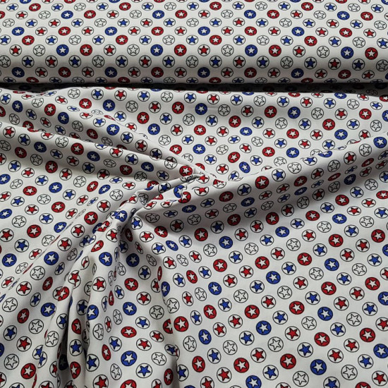 Cotton Stars Circles fabric - Poplin cotton fabric with drawings of stars within circles that remind us of superhero stars. The fabric is 140cm wide and its composition is 100% cotton.