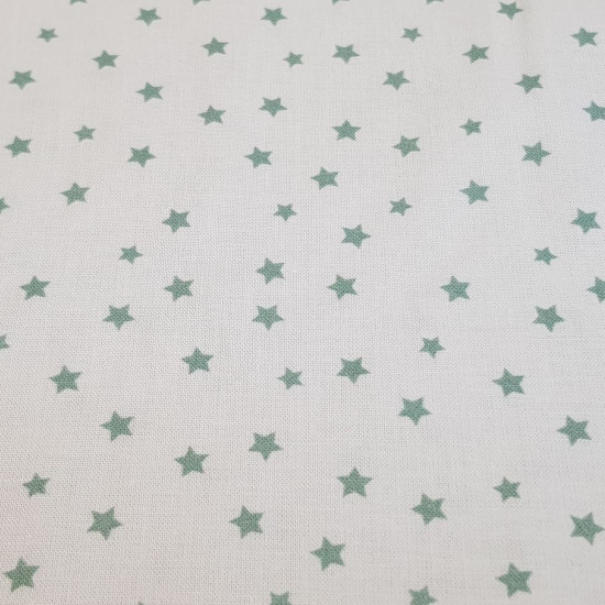Tela Algodón Estrellas Lys - Tela de popelín algodón orgánico con dibujos de estrellas en varios colores y fondos a elegir. La tela mide 150cm de ancho y su composición 100% algodón.