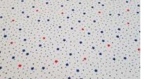 Cotton Multicolor Stars fabric - Fine cotton fabric with patterns of blue and red stars on a white background with little blue dots. The fabric is 150cm wide and its composition is 100% cotton.