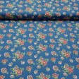 Cotton Roses Texan fabric - Fine cotton fabric with drawings of red and pink roses on a blue denim background. The fabric is 145cm wide and its composition 100% cotton