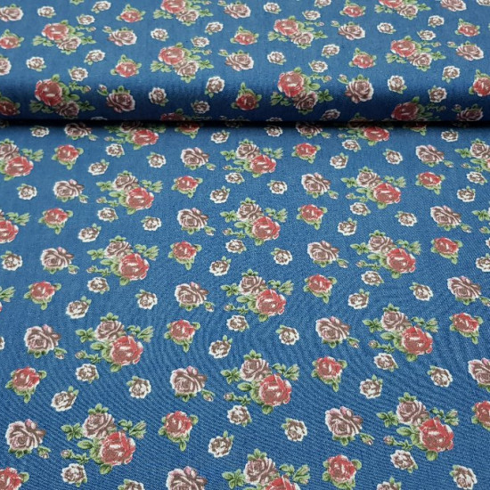 Cotton Roses Texan fabric - Fine cotton fabric with drawings of red and pink roses on a blue denim background. The fabric is 145cm wide and its composition 100% cotton