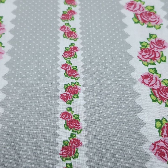 Cotton Roses and Polka Dots Gray fabric - Cotton fabric with drawings of white borders with roses and white polka dots on a gray background. The fabric is 140cm wide and its composition is 100% cotton.