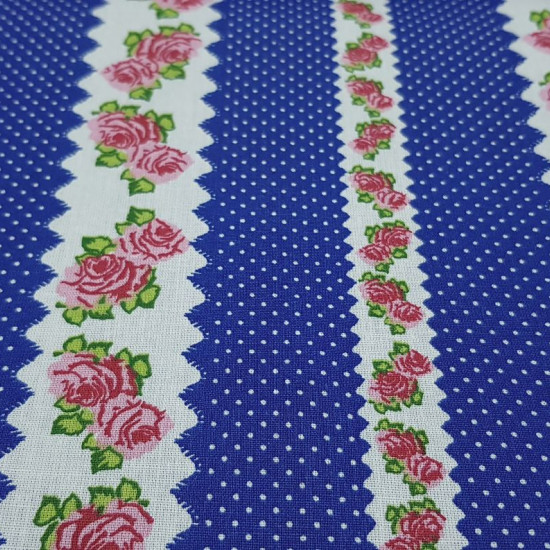 Cotton Roses and Polka Dots Blue fabric - Cotton fabric with border patterns with roses and white polka dots on a blue background. The fabric is 140cm wide and its composition is 100% cotton.