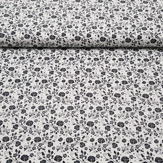 Cotton Flowers Roses White Black fabric - Cotton fabric ideal for Patchwork with drawings of flowers and bouquets of black roses on a white background. The fabric is 150cm wide and its composition is 100% cotton.