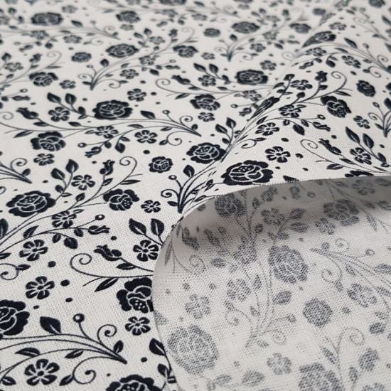 Cotton Flowers Roses White Black fabric - Cotton fabric ideal for Patchwork with drawings of flowers and bouquets of black roses on a white background. The fabric is 150cm wide and its composition is 100% cotton.