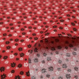 Tela Algodón Flores Margaritas Rojo - Tela de algodón con dibujos de flores con forma de margarita de colores blanco y negro sobre un fondo rojo. La tela mide 140cm de ancho y su composición 100% algodón.