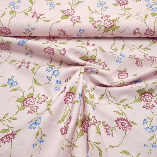 Fine Cotton Flowers Butterfly Blue fabric - Fine batiste cotton fabric with blue flower and butterfly patterns on a light pink background. The fabric is 140cm wide and its composition is 100% cotton.