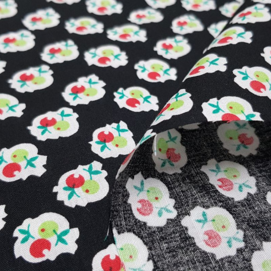 Cotton Fruit Shapes Black fabric - Cotton fabric with drawings of fruit shapes in red and green colors on a black background. The fabric is 140cm wide and its composition is 100% cotton.