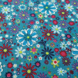 Tela Algodón Flores Colores Mariposas - Tela de algodón con dibujos de flores de varios tamaños y colores sobre un fondo azul petroleo con mariposas. La tela mide 140cm de ancho y su composición 100% algodón.