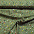 Tela Algodón Flores Topitos Verde - Tela de algodón orgánico con dibujos florales con topitos blancos sobre un fondo verde. La tela mide 150cm de ancho y su composición 100% algodón.