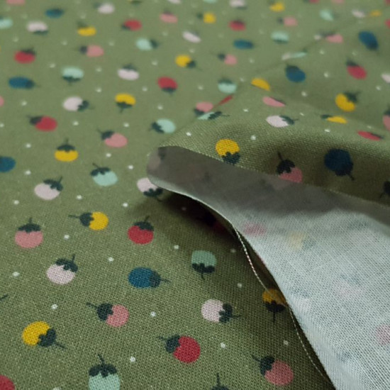 Cotton Flowers Dots Green fabric - Organic cotton fabric with floral patterns with white polka dots on a green background. The fabric is 150cm wide and its composition is 100% cotton.