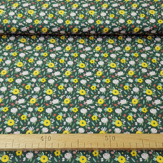 Cotton Flowers Flua Green fabric - Organic cotton fabric with drawings of various types of flowers in various colors on a dark green background. The fabric is 150cm wide and its composition is 100% cotton.