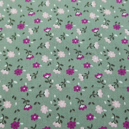 Cotton Flowers 15788 Green fabric - Cotton fabric with flower patterns on an olive green background The fabric is 140cm wide and its composition is 100% cotton.