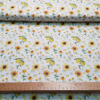 Tela Algodón Girasoles Limones - Tela de algodón orgánico (GOTS) con dibujos de girasoles y limones sobre un fondo blanco. La tela mide 150cm de ancho y su composición 100% algodón.