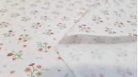 Cotton Flowers Bunny fabric - Organic cotton poplin fabric with drawings of flower bouquets and polka dots on a white background. The fabric is 150cm wide and its composition is 100% cotton.