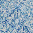 Cotton White Flowers Japanese Bows fabric - Cotton poplin fabric with patterns of white flowers on a blue background with Japanese bows Beautiful fabric to combine with Patchwork work, home decoration and making garments with spring style. The fabric is 1
