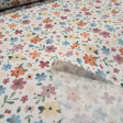 Cotton Flowers Colors Illusion fabric - Cotton poplin fabric with multicolored floral patterns and a gradient effect on a white background. The fabric is 150 cm wide and is made of 100% cotton.