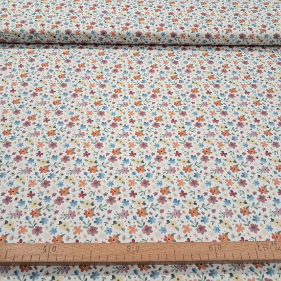 Cotton Flowers Colors Illusion fabric - Cotton poplin fabric with multicolored floral patterns and a gradient effect on a white background. The fabric is 150 cm wide and is made of 100% cotton.