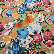 Tela Algodón Flores Tropicales Caras Etnia Algodón Flores Tropicales Caras Etnia - Tela de algodón popelín con dibujos de flores tropicales y rostros de mujeres. La tela mide 150cm de ancho y su composición 100% algodón.