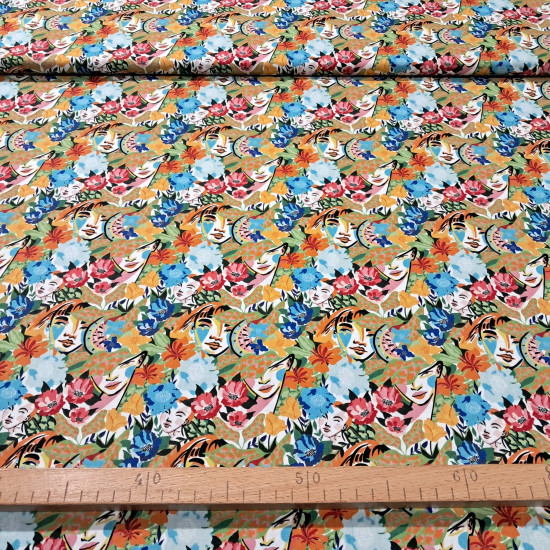 Tela Algodón Flores Tropicales Caras Etnia Algodón Flores Tropicales Caras Etnia - Tela de algodón popelín con dibujos de flores tropicales y rostros de mujeres. La tela mide 150cm de ancho y su composición 100% algodón.