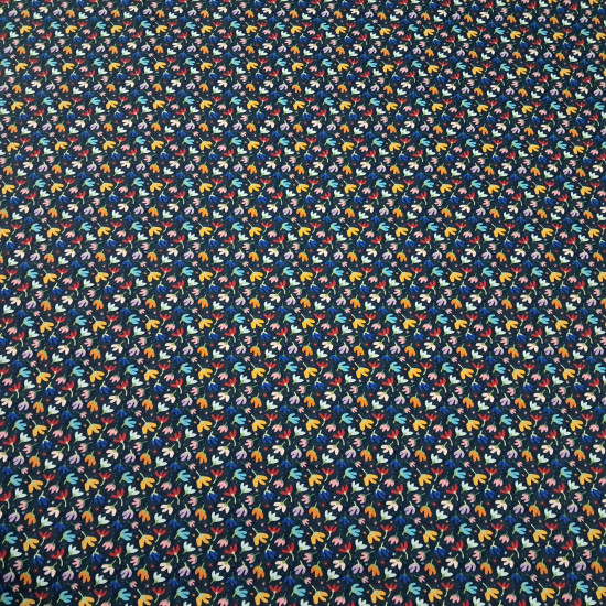 Cotton Flowers Etnia Blue fabric Cotton Flowers Etnia Blue fabric - Cotton poplin fabric with drawings of various colored flowers on a blue background. The fabric measures 150cm wide and is 100% cotton.