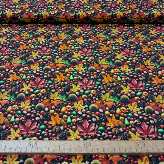 Cotton Autumn Leaves fabric Cotton poplin fabric with a dense print of autumn leaves, chestnuts and pinecones