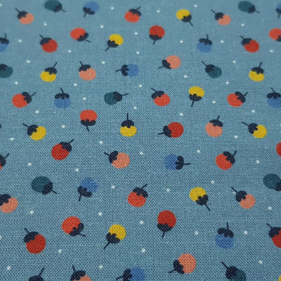 Cotton Flowers Dots Blue fabric - Organic cotton fabric with drawings of small colorful flowers and white polka dots on a blue background. The fabric is 150cm wide and its composition is 100% cotton.
