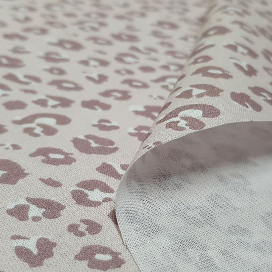 Cotton Animal Print Azania 7002 fabric - Organic cotton poplin fabric with animal print patterns in shades of color similar to powder pink. The fabric is 150cm wide and its composition is 100% cotton.