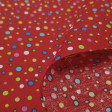 Cotton Multicolor Polka Dots Red Background fabric - Poplin cotton fabric with drawings of multicolored polka dots of different sizes on a red background. The fabric is 150cm wide and its composition is 100% cotton.