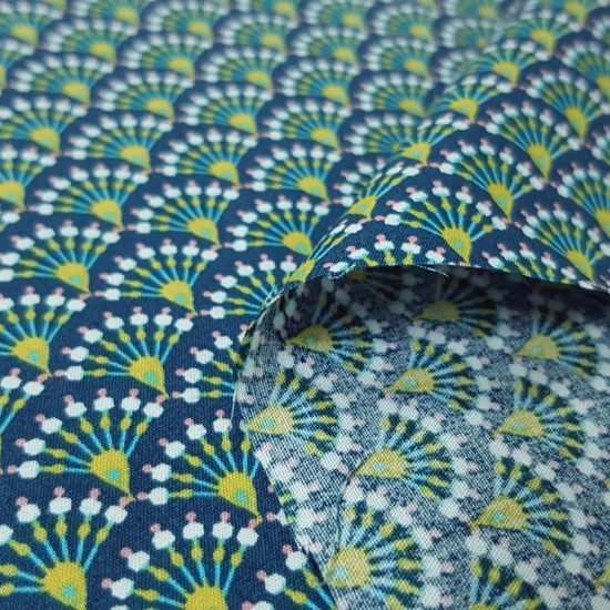 Cotton Mosaic Ornamental Bows fabric - Cotton poplin fabric with drawings of arches making a mosaic with geometric shapes where a blue background predominates. The fabric is 150cm wide and its composition is 100% cotton.