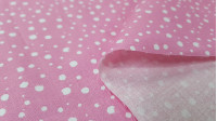 Tela Algodón Manchas Blancas Rosa - Tela de algodón con dibujos de manchas o salpicaduras blancas sobre un fondo de color rosa. La tela mide 140cm de ancho y su composición 100% algodón.