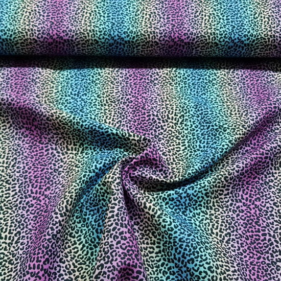 Cotton Animal Print Rainbow fabric - Cotton fabric with an animal print pattern with a multicolored rainbow effect. The fabric is 148cm wide and its composition is 100% cotton.