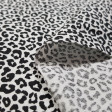 Cotton Animal Print Basic fabric - Poplin-type cotton fabric with animal print drawings in black lines on a background to choose from. The fabric is 140cm wide and its composition is 100% cotton.