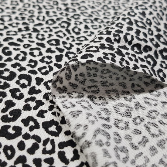 Cotton Animal Print Basic fabric - Poplin-type cotton fabric with animal print drawings in black lines on a background to choose from. The fabric is 140cm wide and its composition is 100% cotton.