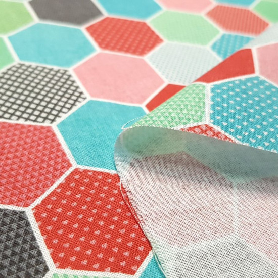 Cotton Honeycombs Hexagons fabric - Cotton poplin fabric with geometric designs of honeycombs in hexagonal shape filled with various motifs and various colors. The fabric is 150cm wide and its composition is 100% cotton.