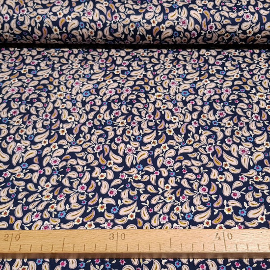 Cotton Cashmere Blue fabric - Cotton fabric with paisley style drawings on a dark blue background. The fabric is 145cm wide and its composition is 100% cotton.