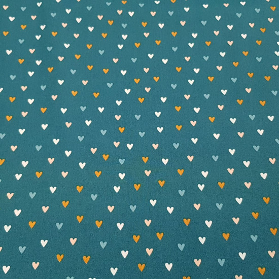 Cotton Hearts Colors fabric - Poplin cotton fabric with drawings of colored hearts on two colored backgrounds to choose from. Heart fabrics add a touch of joy and love to your creations. The fabric measures 150cm wide and its composition is 100%