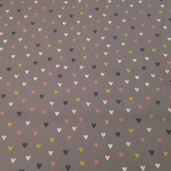 Cotton Hearts Colors fabric - Poplin cotton fabric with drawings of colored hearts on two colored backgrounds to choose from. Heart fabrics add a touch of joy and love to your creations. The fabric measures 150cm wide and its composition is 100%