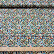 Cotton Mosaic Ornamental Geometric fabric - Cotton poplin fabric with geometric patterns forming an ornamental mosaic of multicolored triangles. The fabric is 150 cm wide and is made of 100% cotton.