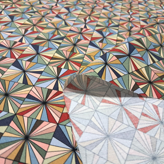 Cotton Mosaic Ornamental Geometric fabric - Cotton poplin fabric with geometric patterns forming an ornamental mosaic of multicolored triangles. The fabric is 150 cm wide and is made of 100% cotton.