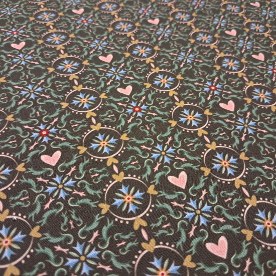 Cotton Geometric Hearts Mosaic fabric Cotton Geometric Hearts Mosaic fabric - Cotton poplin fabric with ornamental designs forming hydraulic-style mosaics and circles with hearts on a brown background. The fabric is 150 cm wide and is made of 100% cotton.