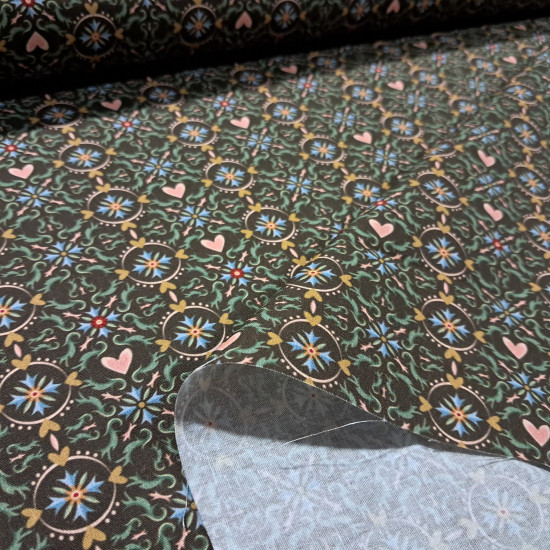 Cotton Geometric Hearts Mosaic fabric Cotton Geometric Hearts Mosaic fabric - Cotton poplin fabric with ornamental designs forming hydraulic-style mosaics and circles with hearts on a brown background. The fabric is 150 cm wide and is made of 100% cotton.