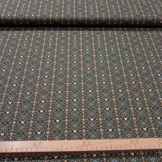 Cotton Geometric Hearts Mosaic fabric Cotton Geometric Hearts Mosaic fabric - Cotton poplin fabric with ornamental designs forming hydraulic-style mosaics and circles with hearts on a brown background. The fabric is 150 cm wide and is made of 100% cotton.