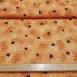 Tela Algodón Halloween Telarañas - Tela de algodón con dibujos de telarañas y arañas de varios tamaños sobre un fondo naranja. La tela mide 150cm de ancho y su composición 100% algodón.
