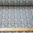 Cotton Mini Pirate Skulls Gray fabric - Cotton fabric digital printing with drawings of tiny pirate skulls with ornaments of flowers and bones on a gray background. The fabric is 140cm wide and its composition is 100% cotton.