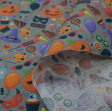 Cotton Halloween Party Candy fabric - Cotton Halloween themed fabric with drawings of pumpkins, masks, witch hats, candies... on a gray background. The fabric is 140cm wide and its composition is 100% cotton.