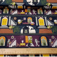 Cotton Halloween Haunted Mansion fabric - Organic cotton fabric with Halloween-themed drawings where different characters appear in a haunted house. The fabric is 150cm wide and its composition is 100% cotton.