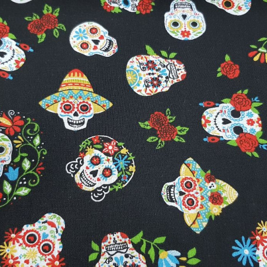 Cotton Skulls Mexican Colors Black Background fabric - Cotton fabric with drawings of Mexican skulls with lots of color on a black background. The fabric is 140cm wide and its composition 100% cotton.