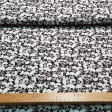 Cotton Terrifying Skulls fabric - Cotton fabric with drawings of terrifying skulls in various sizes on a black background. The fabric is 150cm wide and its composition is 100% cotton.