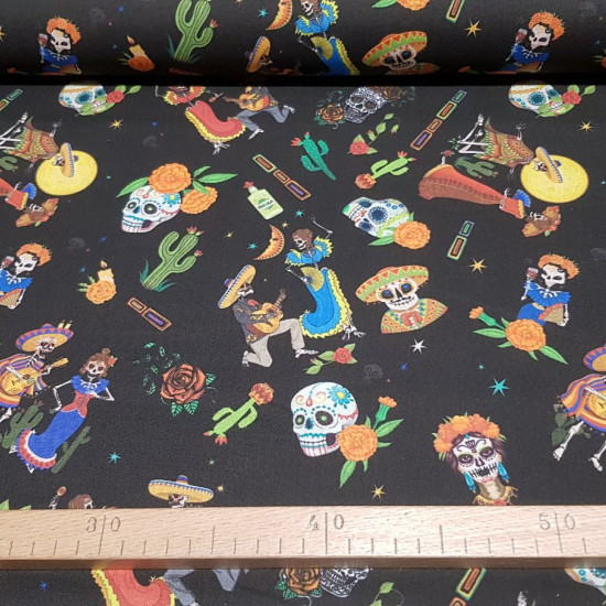 Cotton Skeleton Flowers fabric - Poplin-type cotton fabric with drawings of Mexican skeletons, cactus, a variety of brightly colored flowers contrasting with a black background. The fabric is 150cm wide and its composition is 100% cotton.